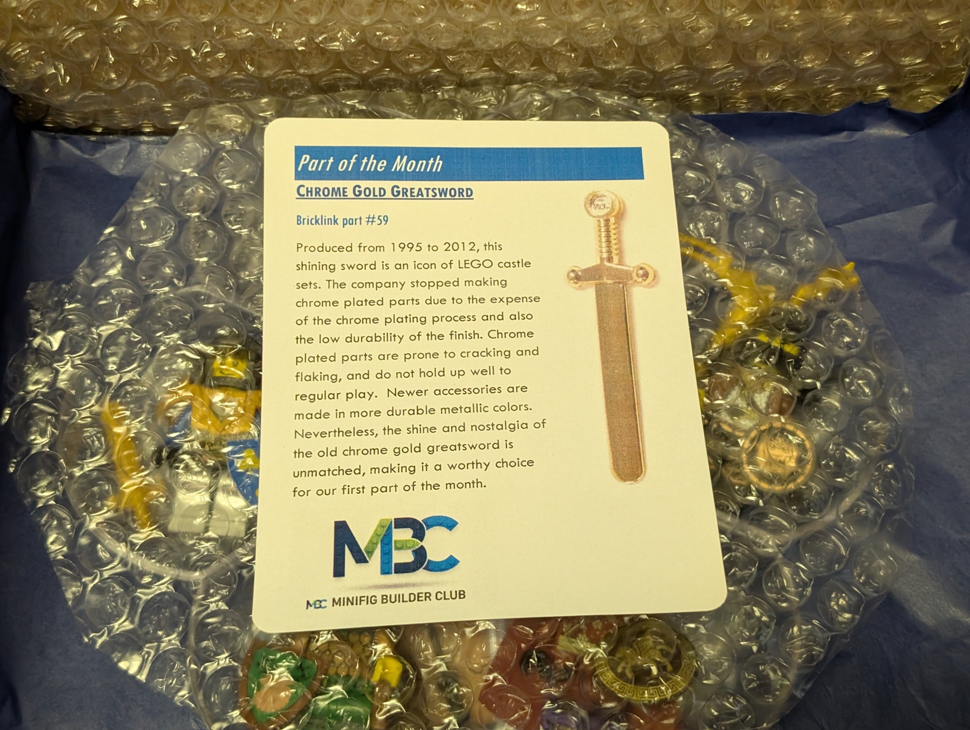 Chrome gold Greatsword with MOC card on bubble wrap