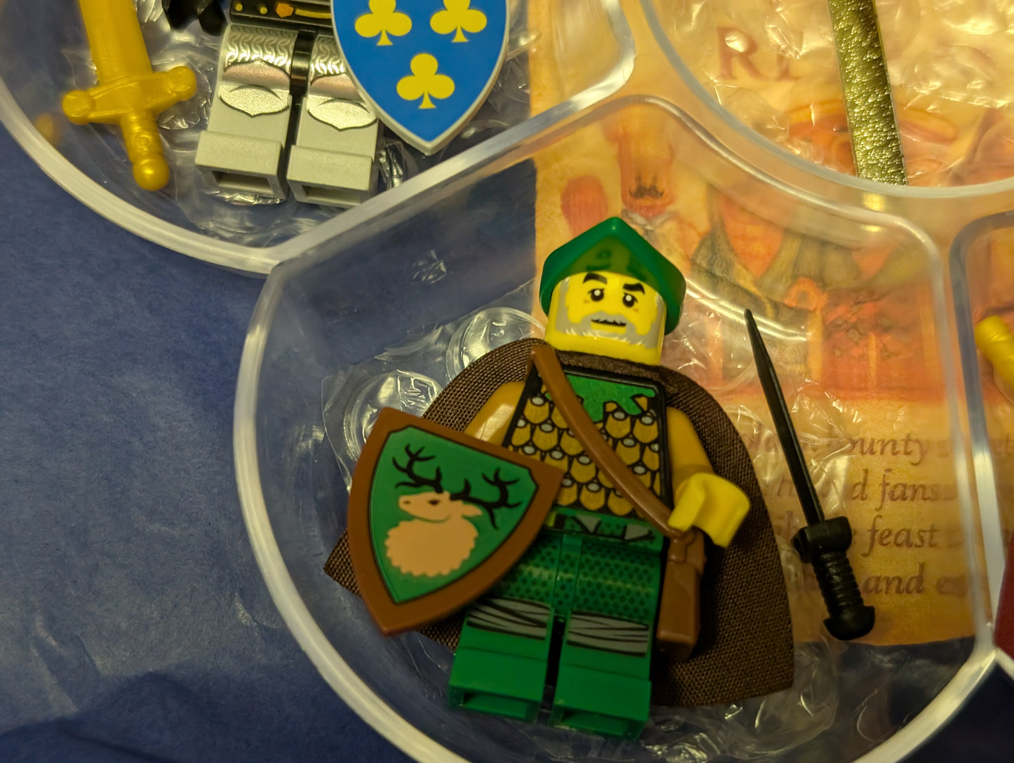 LEGO figure of a warrior with a shield and sword in a clear container